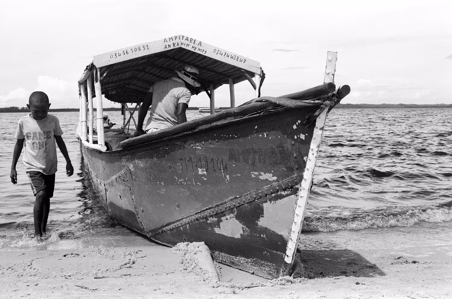 Nolah and his son preparing the boat