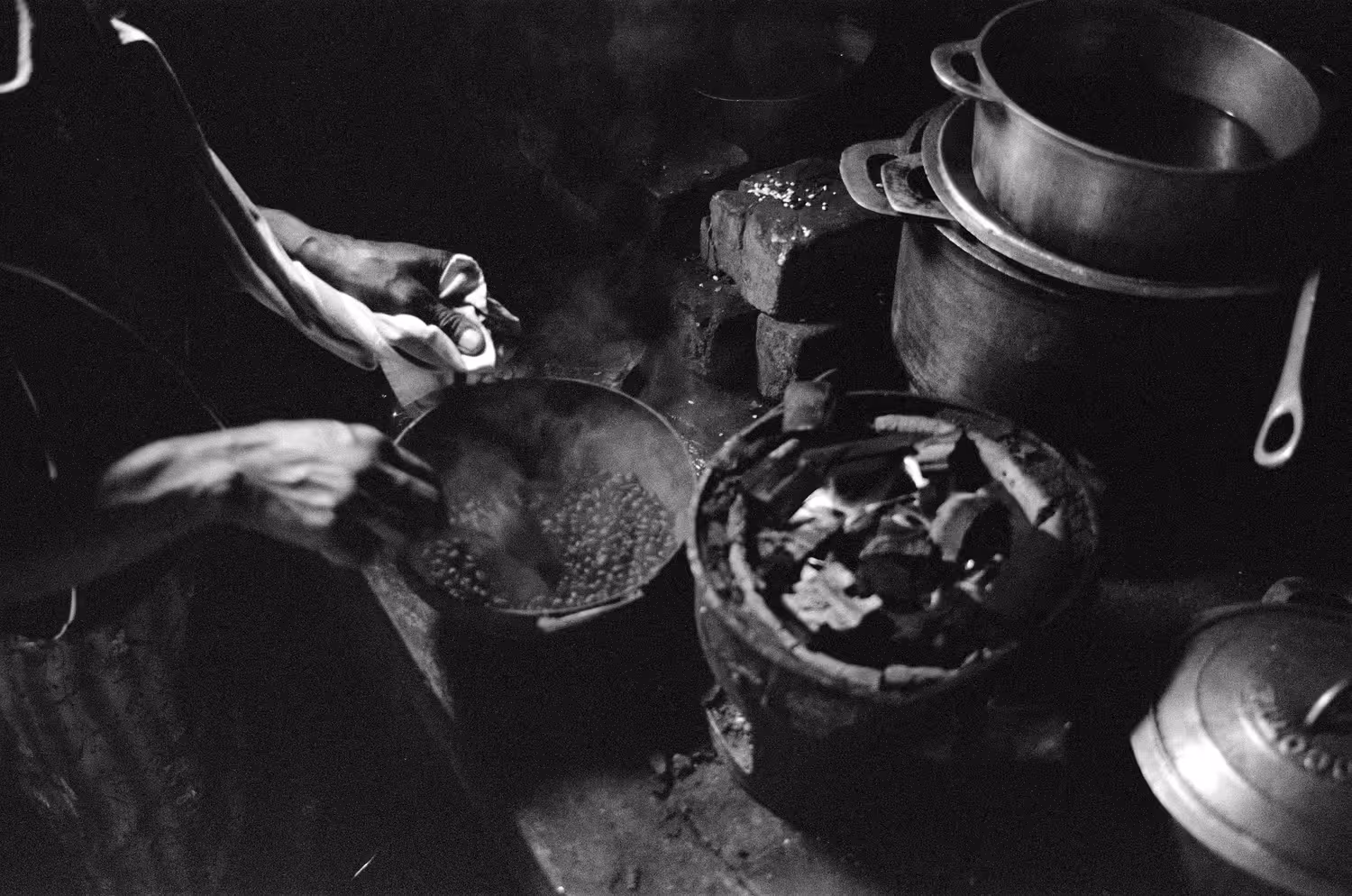 Coffee beans are roasted over charcoals
